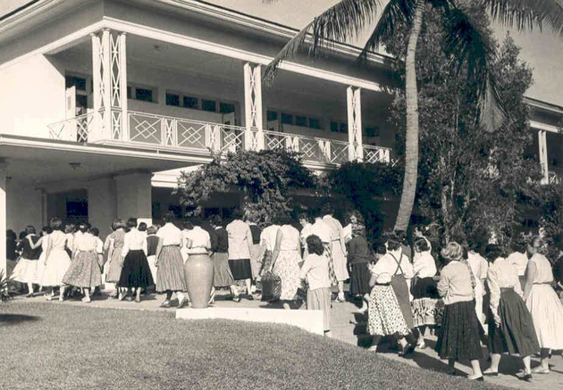 Students walking by Adrian Hall towards the Fine Arts Quad